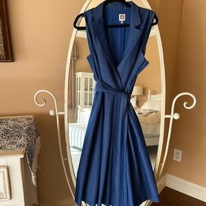 Pleated dress with tie belt. Soft jean like material. Sleeveless . Side zipper.